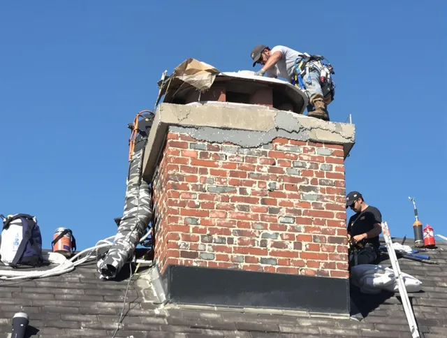 Concord Chimney Sweep installing a custom chimney crown in Concord, NC