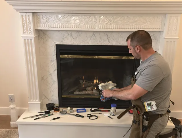 Concord Chimney Sweep performing fireplace maintenance in Concord, NC