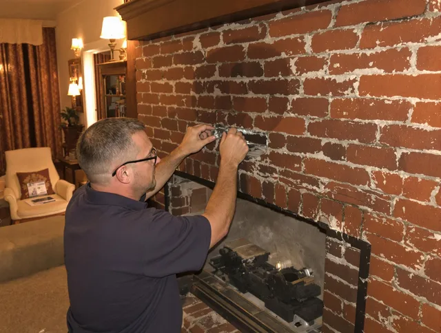 Concord Chimney Sweep expert fixing a fireplace in Concord, NC